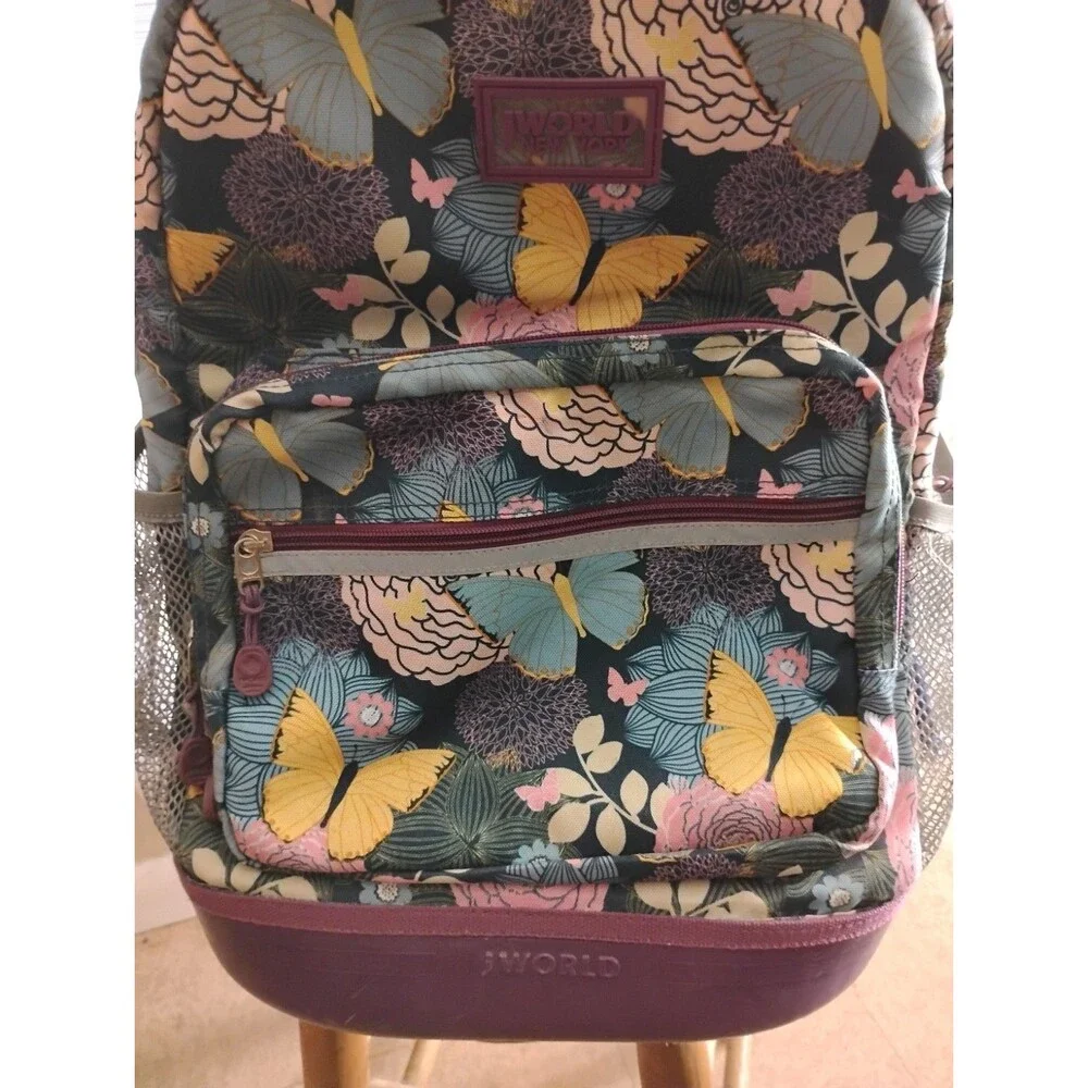 J World New York Rolling Backpack Retractable Handle Mesh Pockets Secret Garden